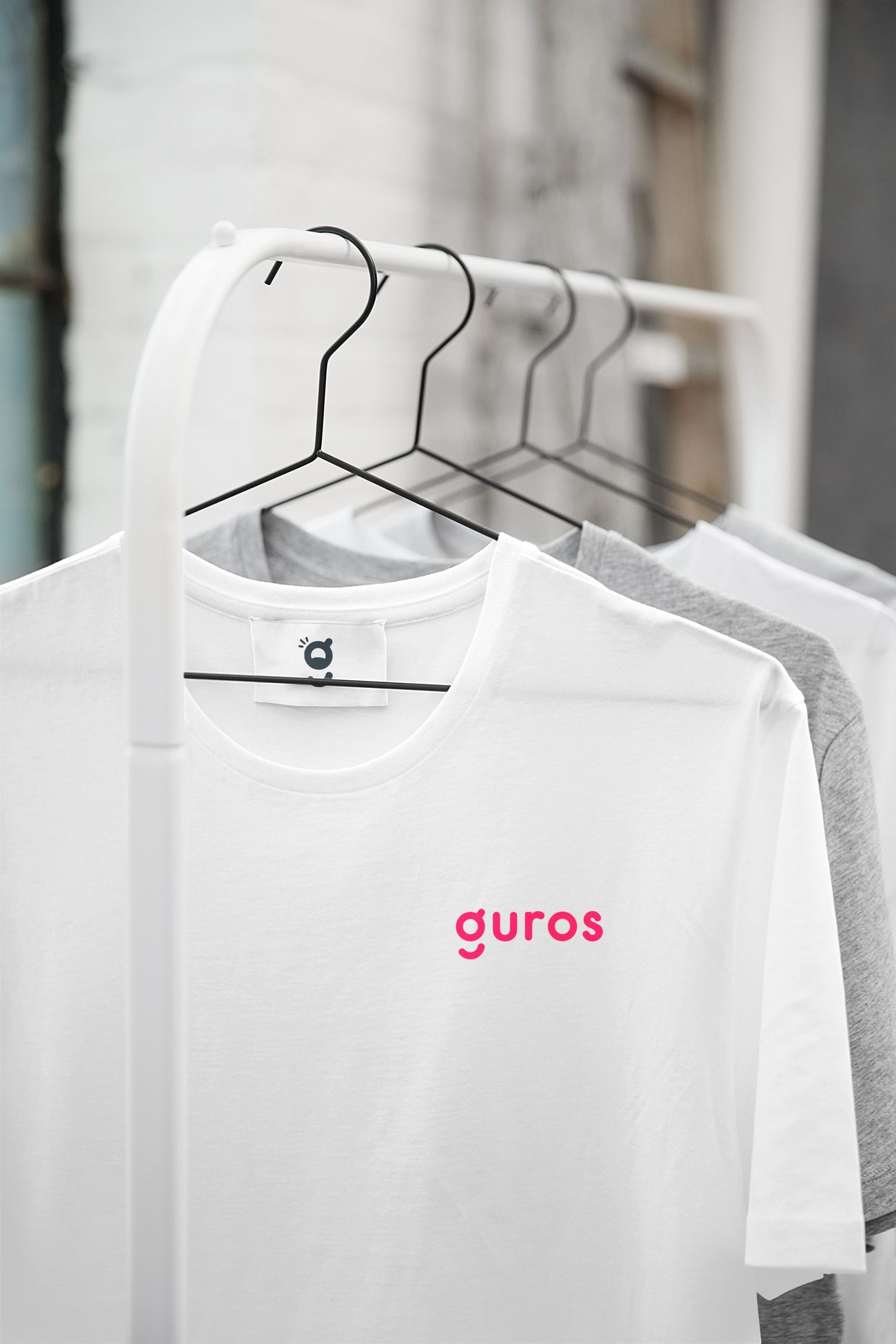 Guros branded t-shirt on a rack