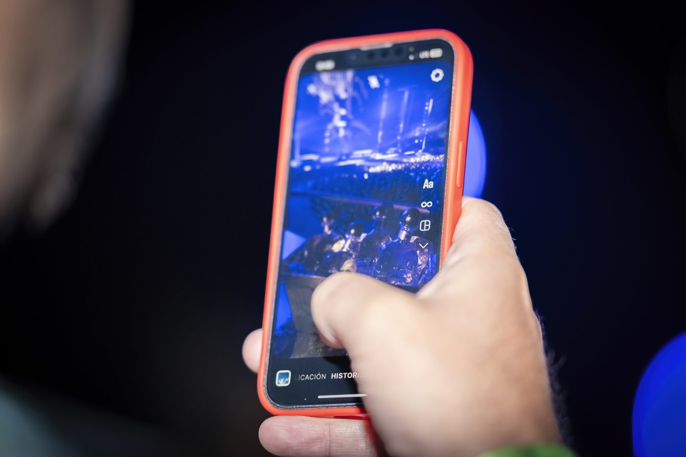 Guest reviewing event photos on a phone